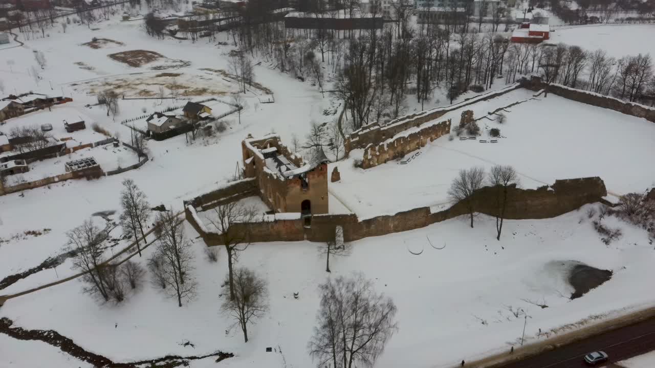 Ruins of Ancient Livonian Order's Stone Medieval Castle Latvia Aerial Drone Top Shot From Above . Restored Castle Capella at Winter in Dobele City. 4K Resolution
