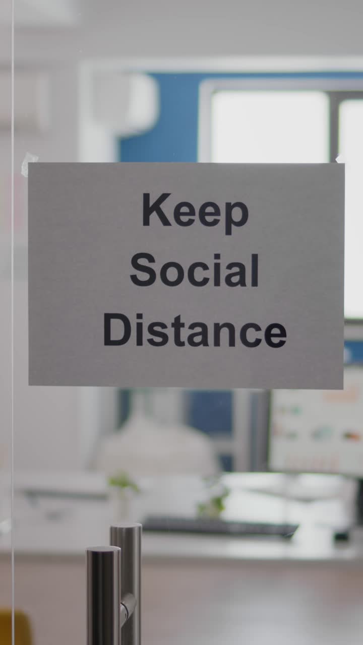 Keep Social Distance sign on office door