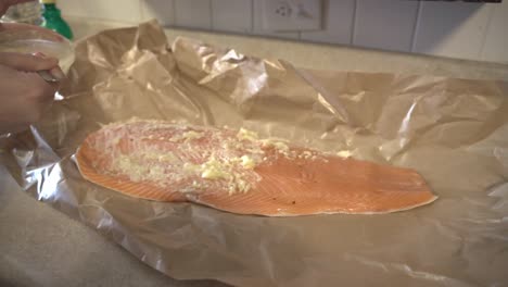 preparing a large salmon filet for cooking