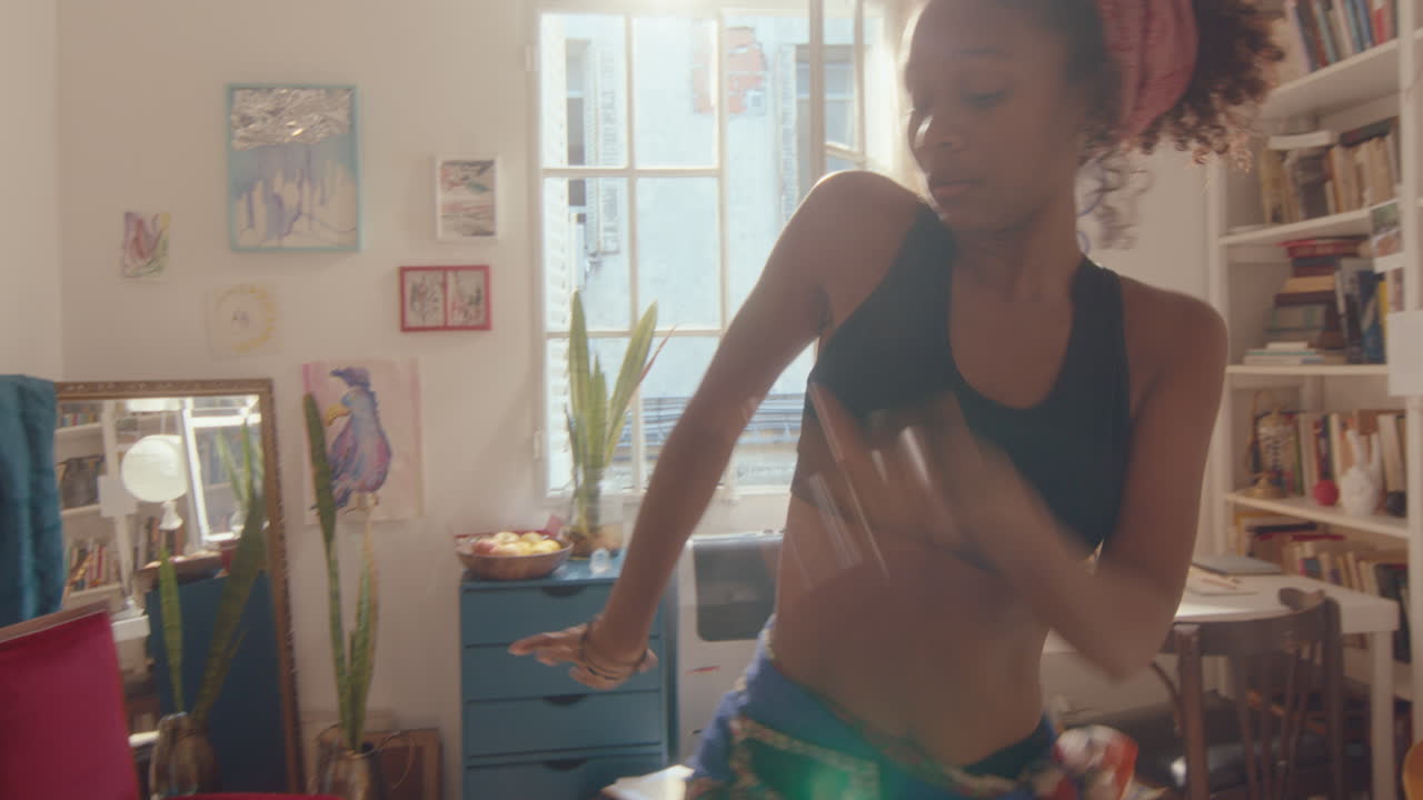 Young Talented Female Dancer Dancing in Room on Sunny Day