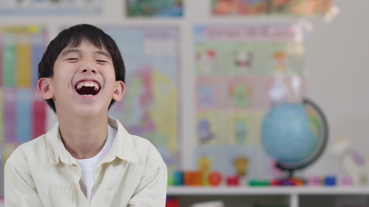 Portrait of a happy student in the classroom