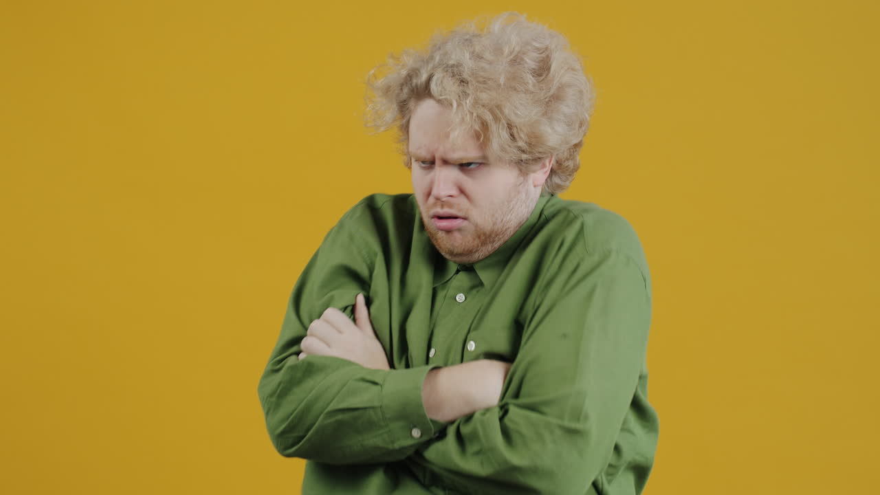 Unhappy Man with Arms Crossed