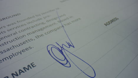 Unknown-person-signing-document-with-pen