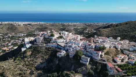 Mojacar-Popular-White-Coastal-Village-on-Top-of-a-Hill-in-Almeria,-Andalusia,-Spain---Aerial-4k