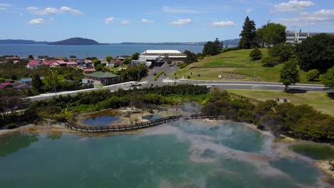 aerial shot of hot spring, natural steamy thermal basin - new zealand, rotorua, kuirau park