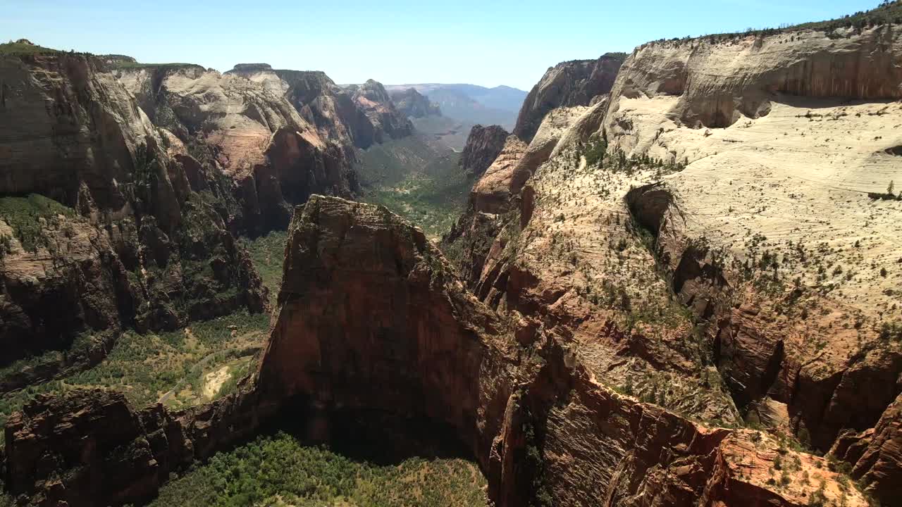 Aerial drone footage offering a bird's-eye view of Zion National Park, highlighting the rock formations