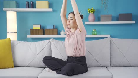 Happy-and-peaceful-Asian-teenage-girl-does-breathing-exercise.