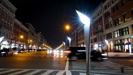 nighttime city street with traffic and modern lights