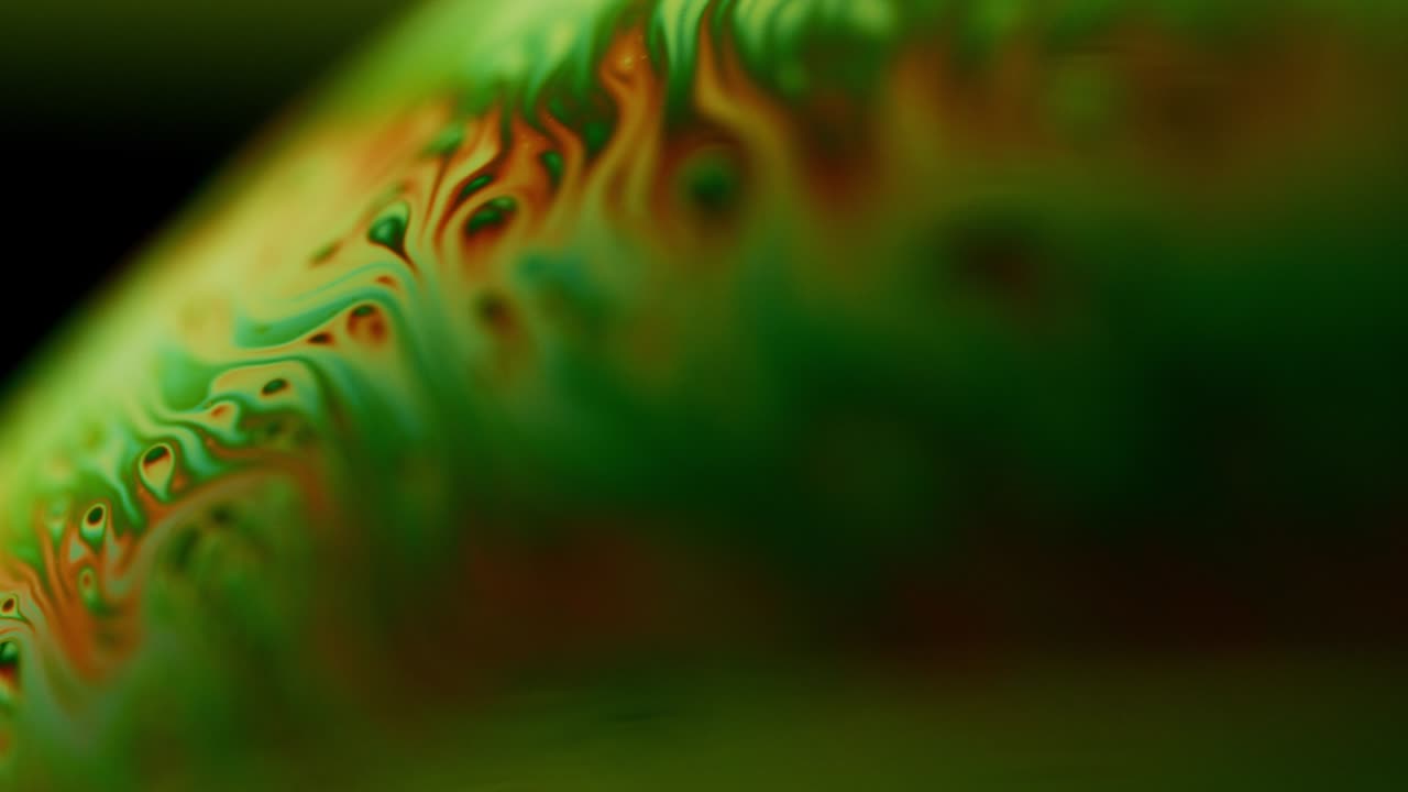 Macro Abstract Shot of Ink-Like Liquid with Swirling Colors