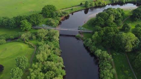 Aerial view over Rickerby Park and Memorial Bridge above River Eden on beautiful summer's day - Carlisle, England
