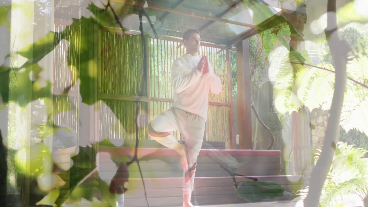 анимация листьев над кавказским человеком, практикующим йогу и медитирующим