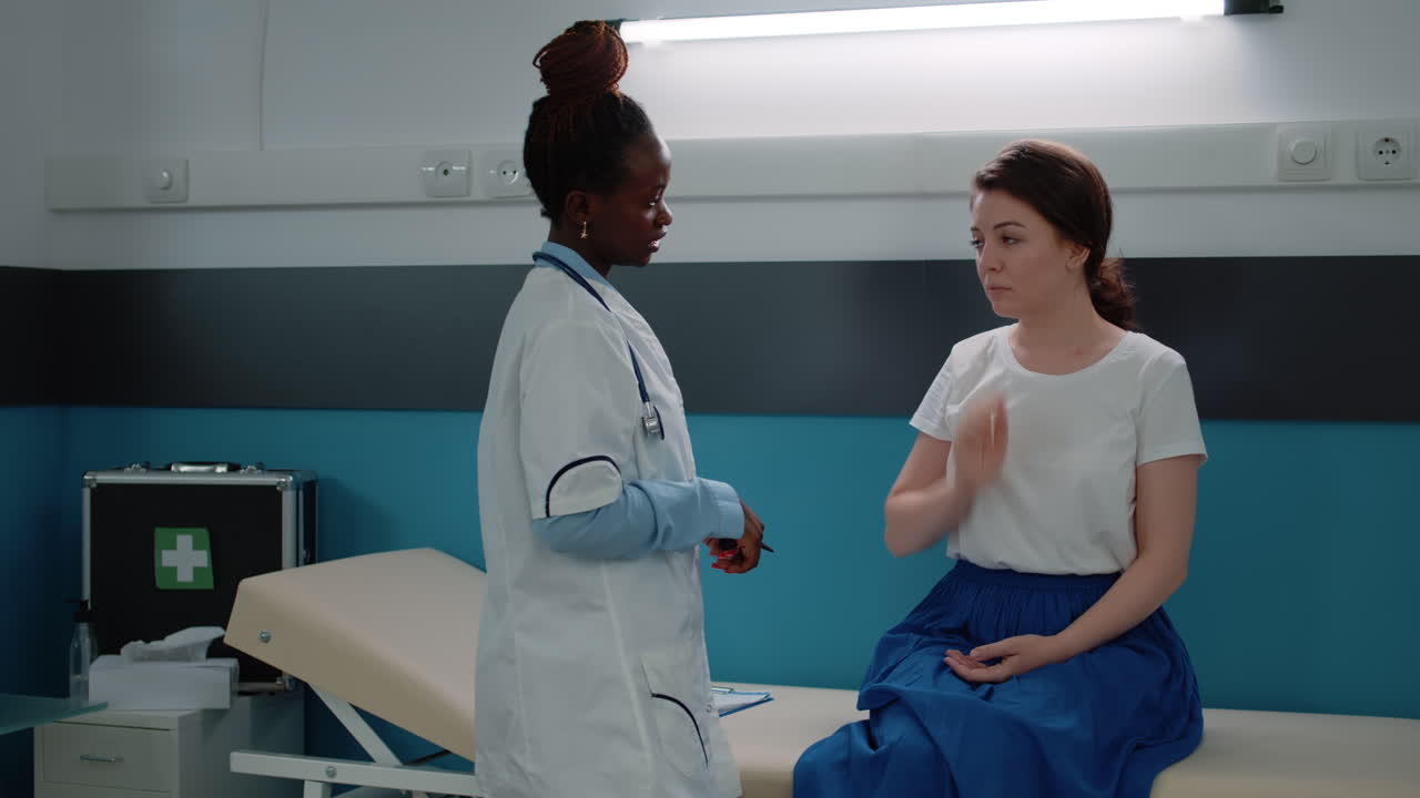 Doctor examining patient's ear