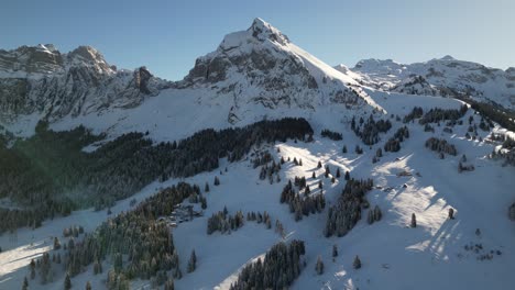 Snowy-swiss-mountains-range-landscape-Alps-Switzerland-winter-aerial-nature