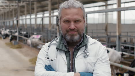 male vet posing at cattle farm