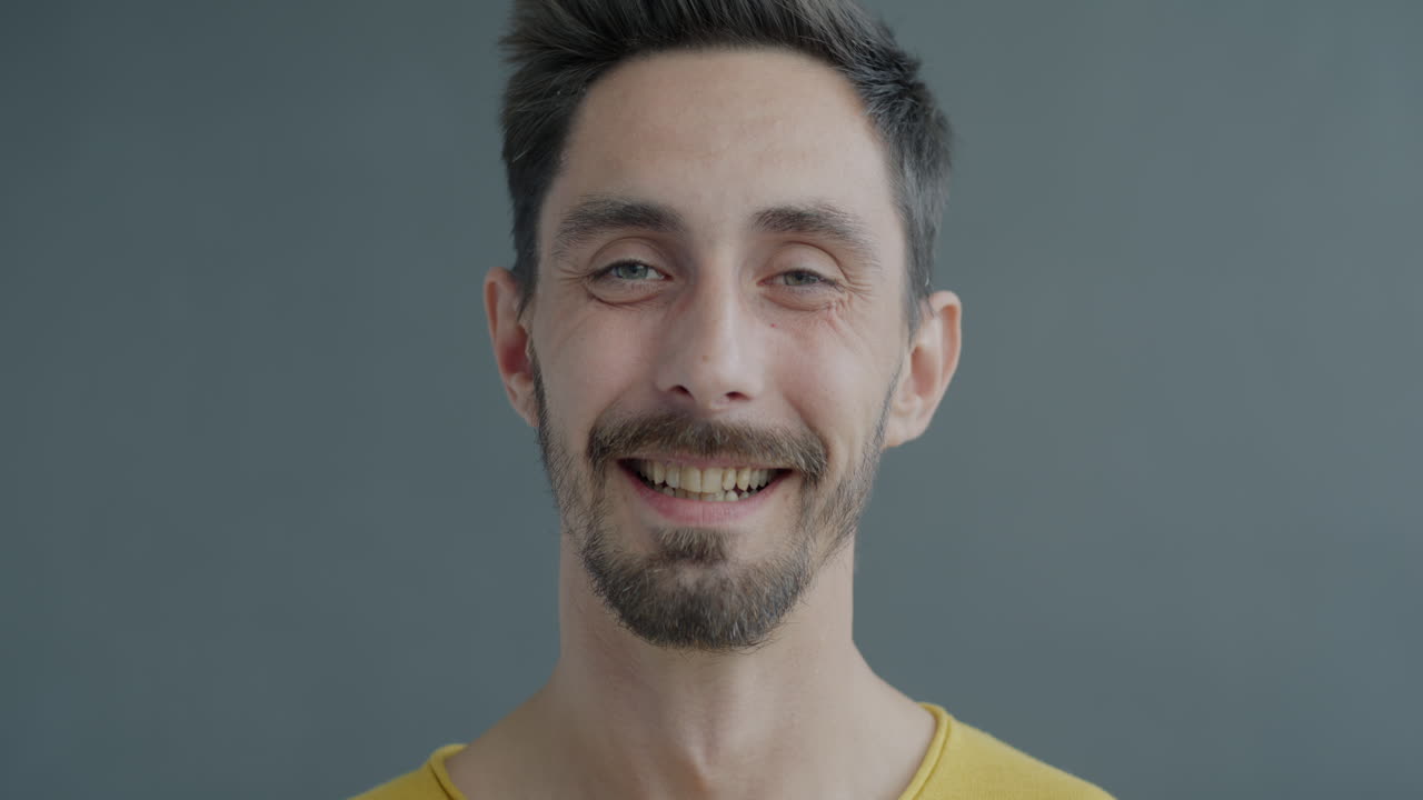 Smiling Man in Yellow Shirt