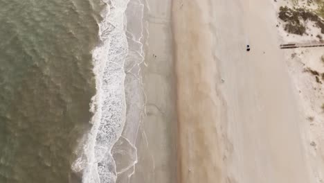 Drone-of-an-empty-beach-in-Tybee-Island-with-movement