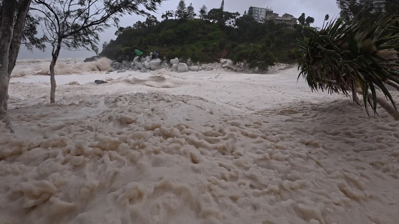 Cyclone Alfred 2025 - Sea Foam Washed Up Onto The Beach During Cyclone In Gold Coast, QLD, Australia. - closeup shot