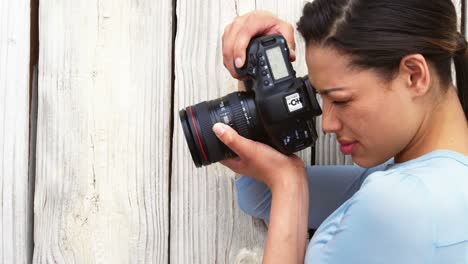 photographer taking photo with digital camera