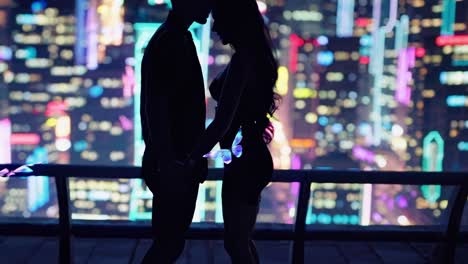 couple in love on a rooftop at night