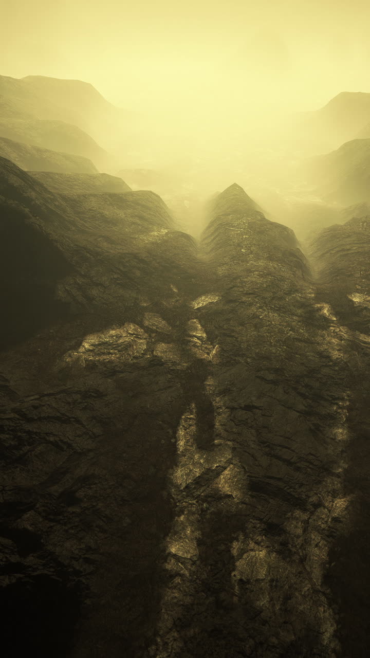 vista aérea de un valle de montaña lleno de niebla