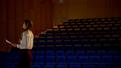 young caucasian businesswoman practicing speech in empty auditorium 4k