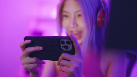 woman gaming on smartphone, live stream