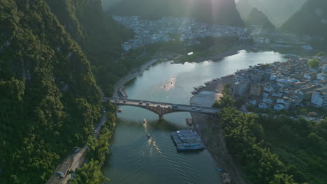 Aerial view of traffic on the Yangshuo bridge, summer sunset in Guangxi, China