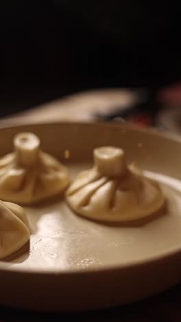 preparing khinkali