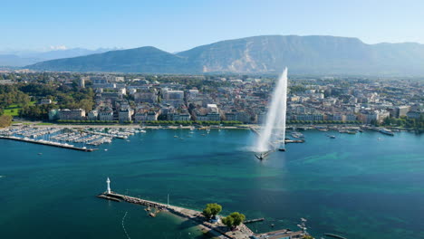 City-Harbor-Of-Geneva-With-Jet-Deau-Fountain-In-Switzerland,-Mount-Salève-In-The-Background