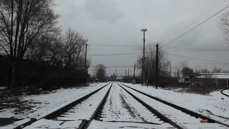 a person crosses a railway line on a bicycle