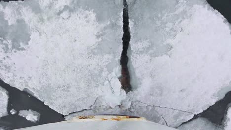 Ship's-bow-breaking-sea-ice-in-the-Svalbard-archipelago-Norway