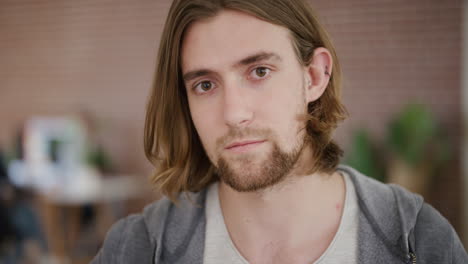 close-up-portrait-of-cute-young-man-removes-glasses-student-geek-looking-at-camera-in-office-workspace-slow-motion