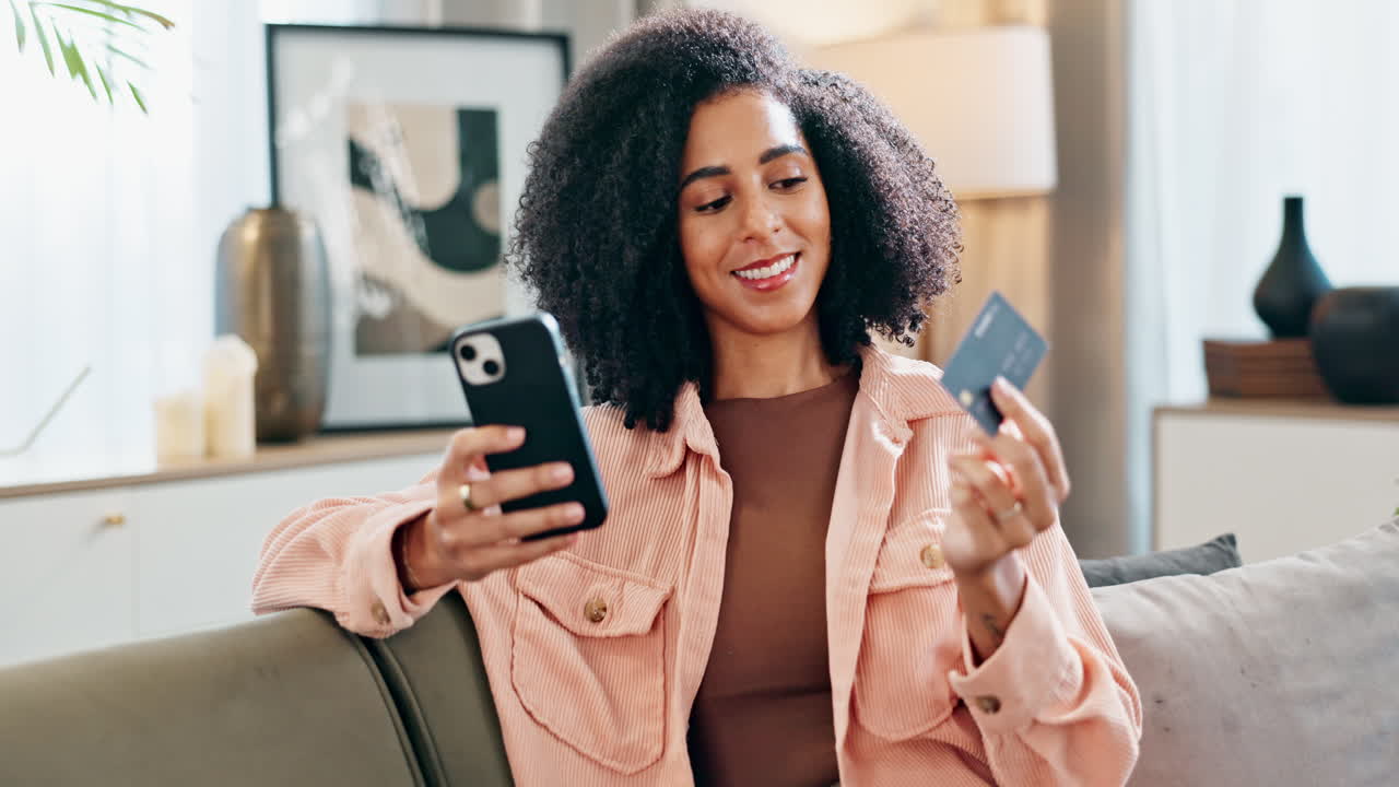Woman shopping online with credit card and smartphone