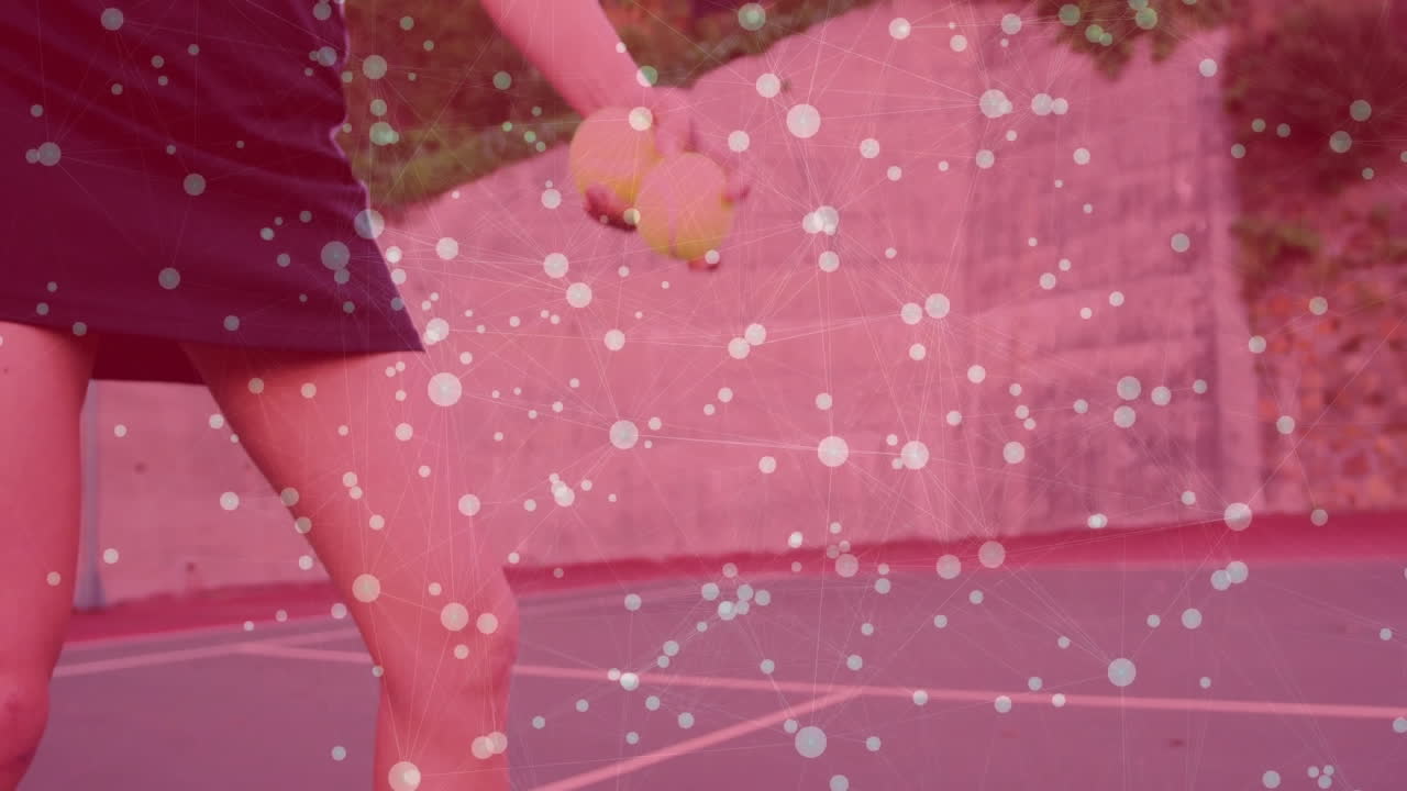 female athlete standing on tennis court holding two balls, presenting animated network overlay