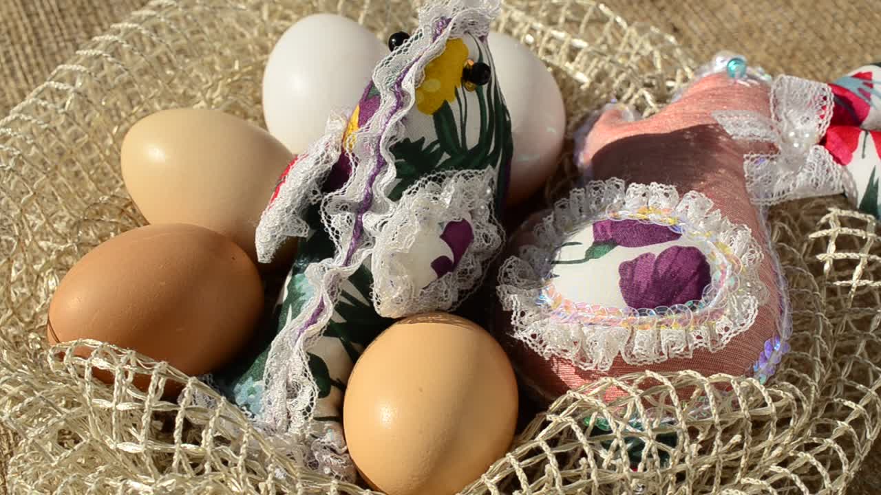 Eggs in a basket against a sacking. Easter still life