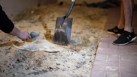 digging out a barrel from the ground