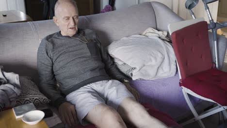 elderly man relaxing on the couch