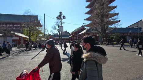 visitors exploring a traditional japanese temple