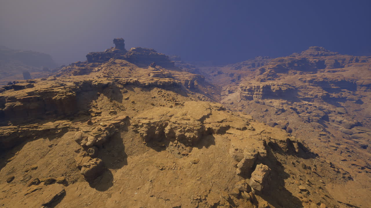 Majestic rocky landscape with steep cliffs and a clear blue sky