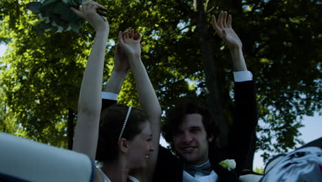 just married couple in a convertible car