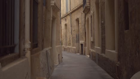 empty narrow alley in historic town of montpellier in france