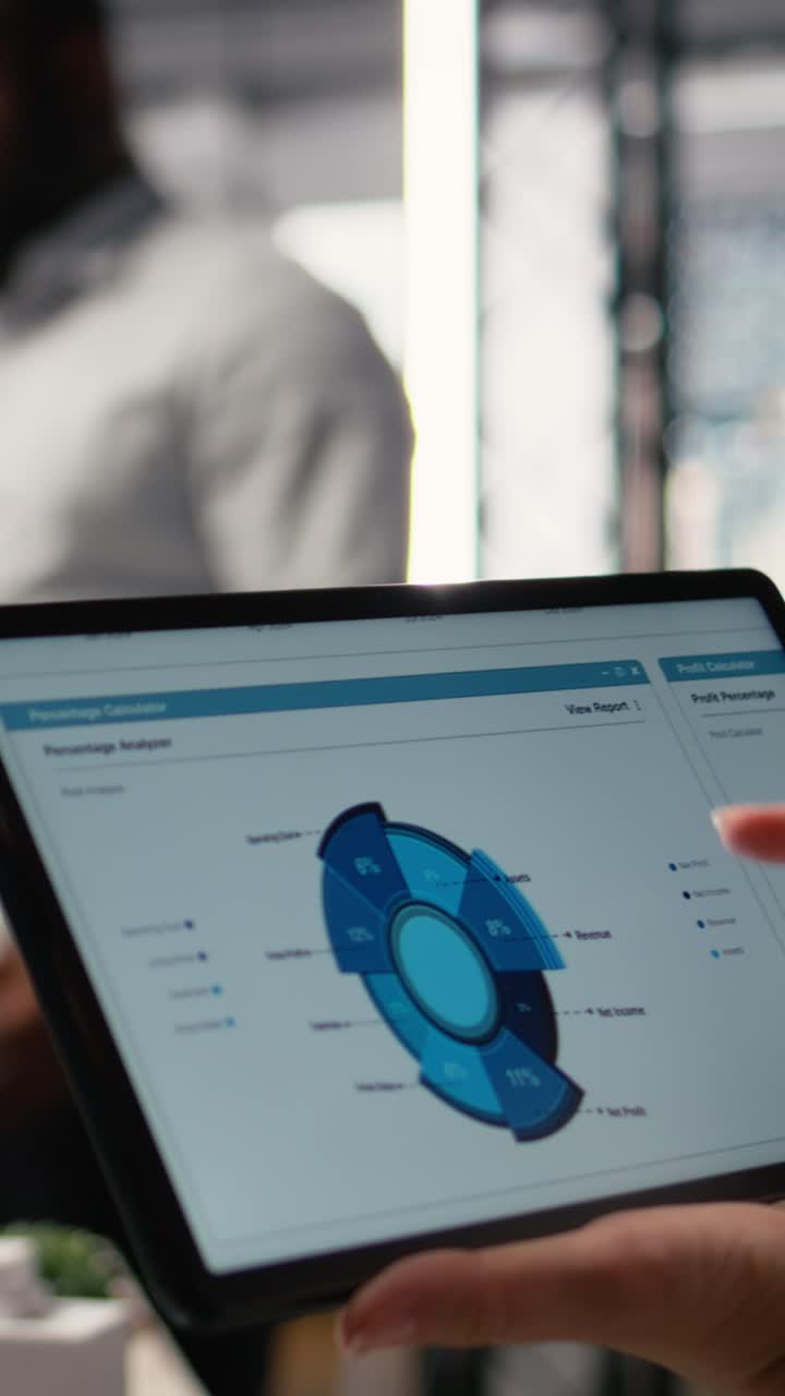 Vertical Video Woman property engineer searching layout details on laptop in the office