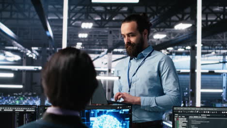 manager supervising work of server room engineer using ai