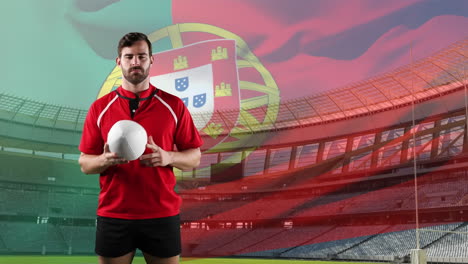 professional rugby player standing in front of a flag and stadium