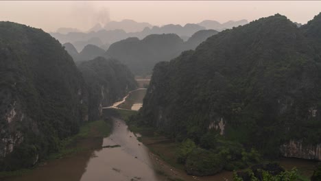 misty valley landscape with kayaks in vietnam
