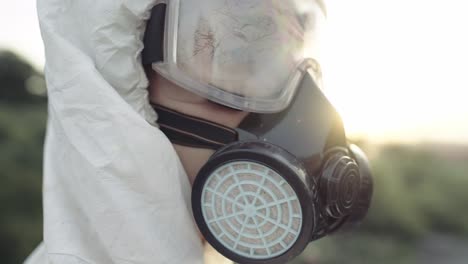 Portrait-shot-worker-in-protective-mask-and-respirator-outdoors