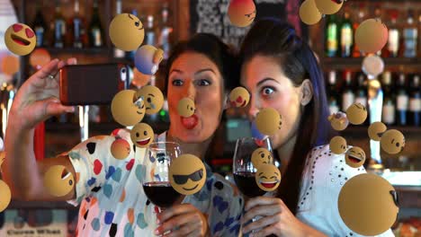 Emoji-icons-with-friends-taking-a-selfie-in-the-background-4k