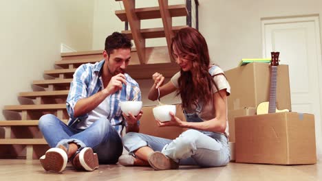 happy couple eating pasta together