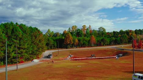 Laying-drainage-pipes-into-the-ground,-construction-site-in-Georgia,-USA