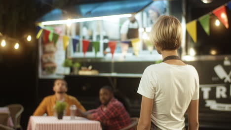 Happy-Pretty-Cheerful-Young-Woman-In-Apron-With-Blond-Short-Hair-Turning-And-Smiling